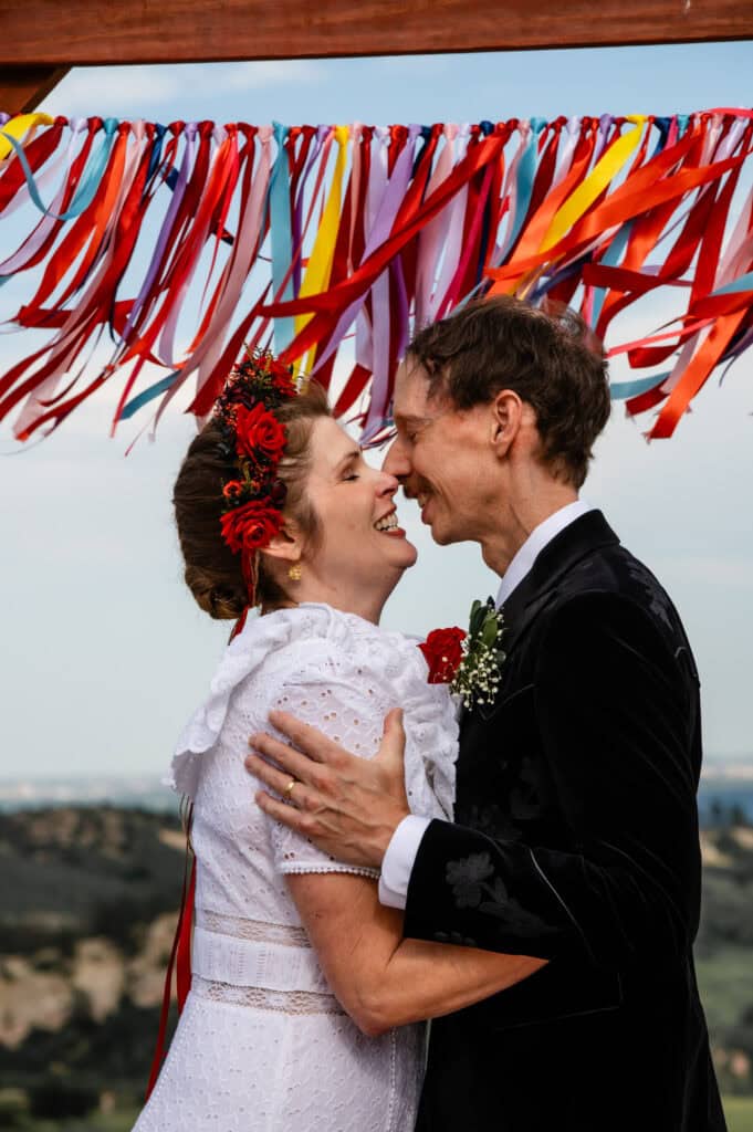 Bride and Groom Sharing a First Kiss
